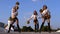 Trio girls cheerleaders with pompons dancing outdoors