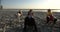 A trio of girls dancers dance an active synchronized dance on the beach