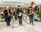 A trio of musicians entertaining the crowd at Christmas market in the UK