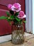 Trio of Pink `Lavender Simplicity` Roses in a Chicken-Wire Covered Jar