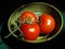 A Trio of Ripe Red Tomatoes on the Vine in a Japanese Pottery Bowl