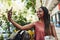 The trip wont be worth it without the selfies. a young woman taking a selfie while out for lunch.