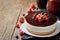 Triple chocolate mousse cake decorated with fresh berries