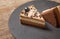 Triple chocolate mousse cake on wooden background