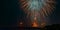 Triple fireworks above highway bridge