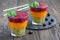 Triple smoothie in glass: kiwi-mint, mandarin-apricot and strawberry-blueberry