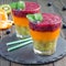 Triple smoothie in glass: kiwi mint, mandarin apricot and strawberry blueberry, square format
