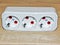 Triple socket on a wooden background