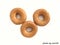 Triple sweet donuts on the white background
