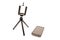 Tripod and nearby smartphone lying isolated