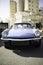 The Triumph Spitfire - British two-seat vintage sports car on a city street.