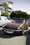 The Triumph Spitfire - British two-seat vintage sports car on a city street.