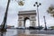 Triumphal arch. Arc de triomphe. View of Place Charles de Gaulle. Famous touristic architecture landmark in rainy day. Long expos