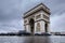 Triumphal arch. Arc de triomphe. View of Place Charles de Gaulle. Famous touristic architecture landmark in rainy day. Long expos