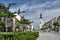 TRNAVA, SLOVAKIA Local and visitor stroll the Trojicne square, near the city tower, In Trnava, Slovakia