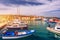 Trogir boats and waterfront view, UNESCO town in Croatia landmarks. View of historic buildings and port with boats in Trogir town