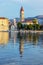 Trogir cathedral is mirroring in sea, Croatia, sunrise time