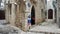 Trogir, Croatia - 07/25/2015 - Stone houses in narrow street of old town, beautiful architecture with archs and stairs