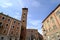 Trojan Tower of Asti. High brick tower and chamber of commerce building in Piazza Medici