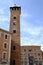 Trojan Tower of Asti. High brick tower and chamber of commerce building in Piazza Medici