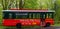 Trolley bus sitting idle in Springtime rain storm