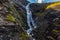 Trollstigen or Trolls Path is a serpentine mountain road in Norway