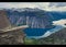 Trolltunga - famous rock formation and tourist famous hike, beautiful norwegian summer landscape with fjord, mountain and lake