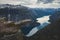 Trolltunga - famous rock formation and tourist famous hike, beautiful norwegian summer landscape with fjord, mountain and lake