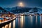 Tromso\\\'s Urban Nightscape: Arctic City under a Full Moon with Bridge
