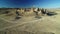 Trona Pinnacles Rock Spires Silhouettes in Mojave Desert Near Death Valley California Aerial Shot Rotate Left