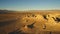 Trona Pinnacles Rock Spires Sunset Silhouettes in Mojave Desert Near Death Valley California Aerial Shot