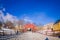 TRONDHEIM, NORWAY - APRIL 04, 2018: Outdoor view of people walking in an old wooden bridge Gamle Bybro with some timber