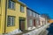 TRONDHEIM, NORWAY - APRIL 04, 2018: Outdoor view of Scandinavian wooden buildings stand along old street in Trondheim