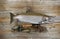 Trophy salmon with fishing gear on rustic wood