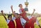 Trophy, winner and football children with success, winning and excited celebration for sports competition or game on