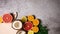 Tropic fruits, lemons, coconut, oranges appear next to cutting board - Stop motion