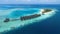 The Tropical aerial view with maldives paradise scenery seascape with water villas