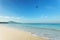Tropical andaman seascape scenic off mai khao beach and wave crashing on sandy shore in phuket thailand with airplane takes off o