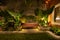 Tropical Backyard Garden at Night with Various of Plants