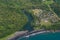 The tropical bay with stony beach, boats and buildings, aerial view. Luganville, Espiritu Santo, Vanuatu.