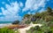 Tropical beach and ancient mayan ruins on a cliff at Tulum