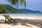 Tropical beach. Beach chairs on the white sand beach