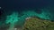 Tropical beach and blue lagoon. Bali, Indonesia. People do snorkling.