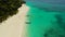 Tropical beach and blue lagoon. Puka Shell Beach, Boracay Island, Philippines, aerial view.