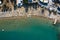 Tropical beach with colorful umbrellas - Top down aerial view. Lindos , Rhodes, Greece.