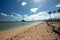 Tropical beach in front of Mokolii island also known as Chinamans Hat as seen from Kualoa Regional Park on the North Shore of Oahu