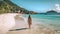 Tropical Beach Landscape Photography: Woman Walking Towards Azure Water