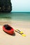 Tropical beach landscape with red canoe boat