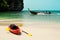 Tropical beach landscape with red canoe boat at ocean