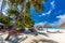 Tropical beach in Maldives with palm trees and vibrant lagoon